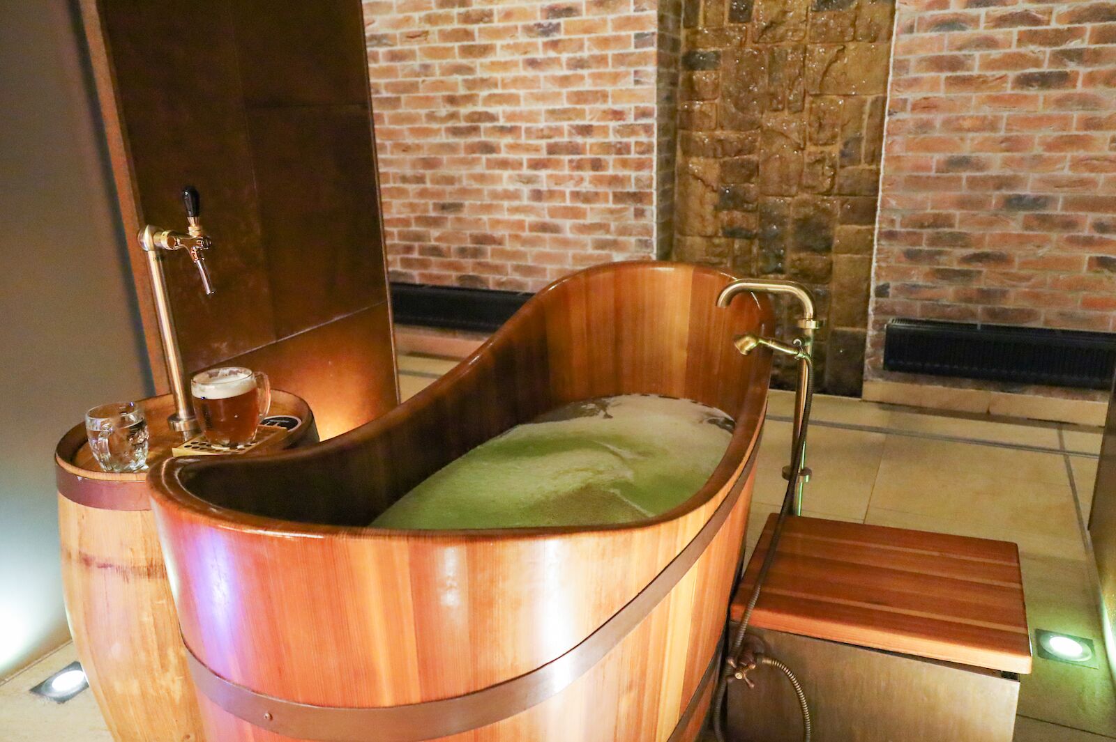 A copper tub filled with beer at the beer spa is one of the most fun things to do in Prague