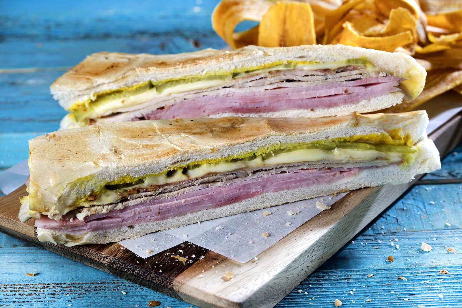 the cuban sandwich from versailles latin restaurants in miami on blue table