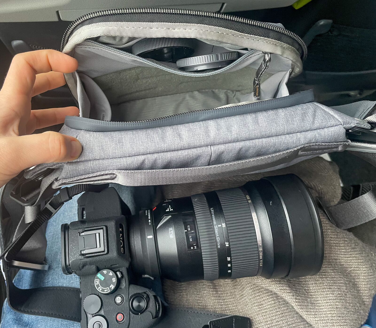 Peak Design Sling Bag next to large camera lens