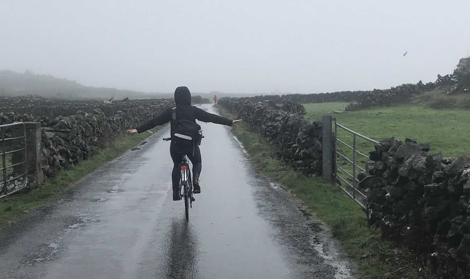 woman biking in rain