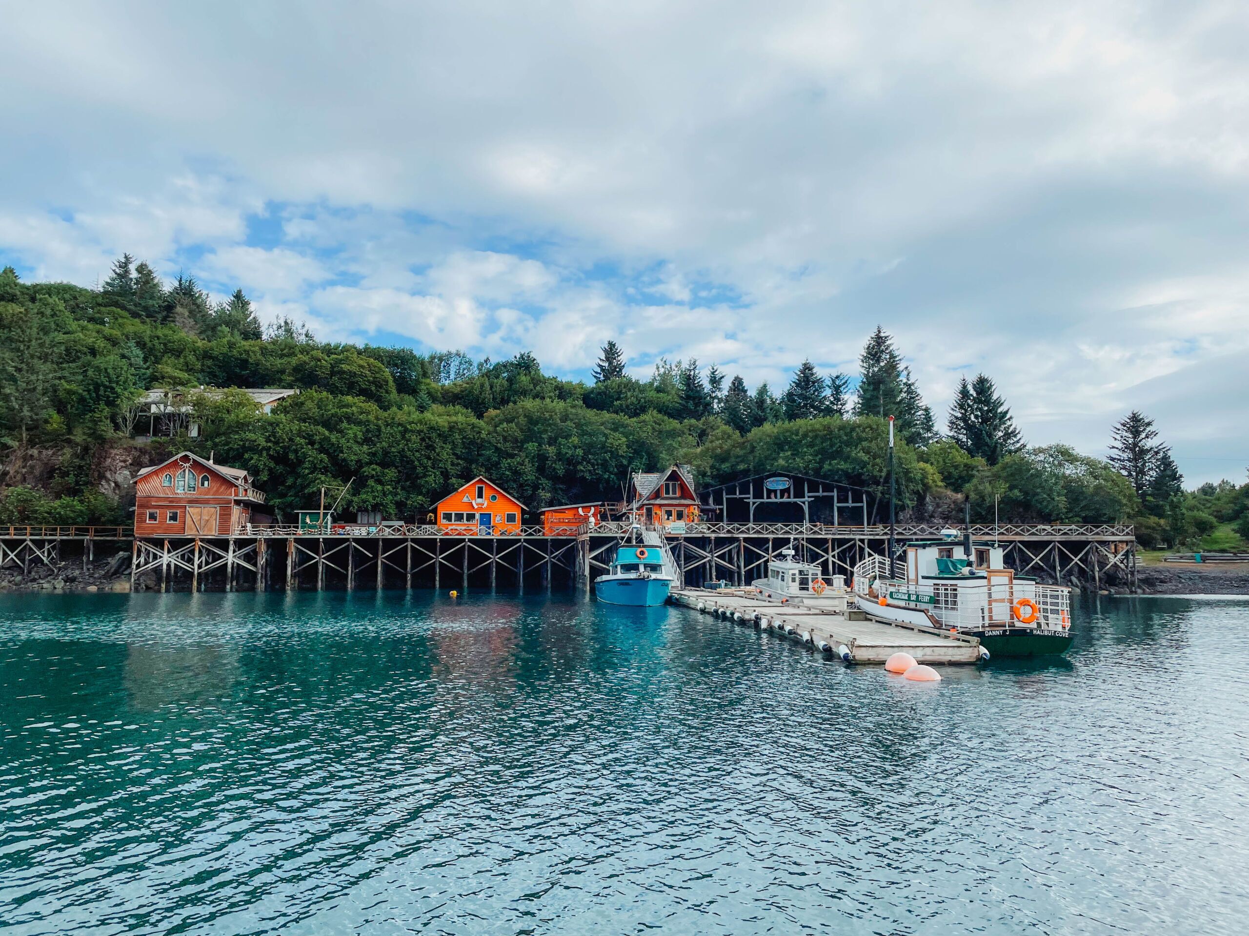 Colorful buildings in Halibut Cove, one of the cutest places to visit on an Alaska honeymoon