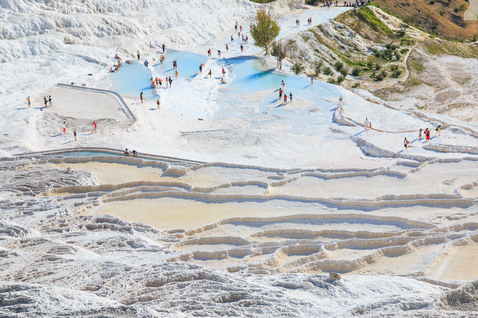 bathers relax in the terraced Pamukkale hot springs