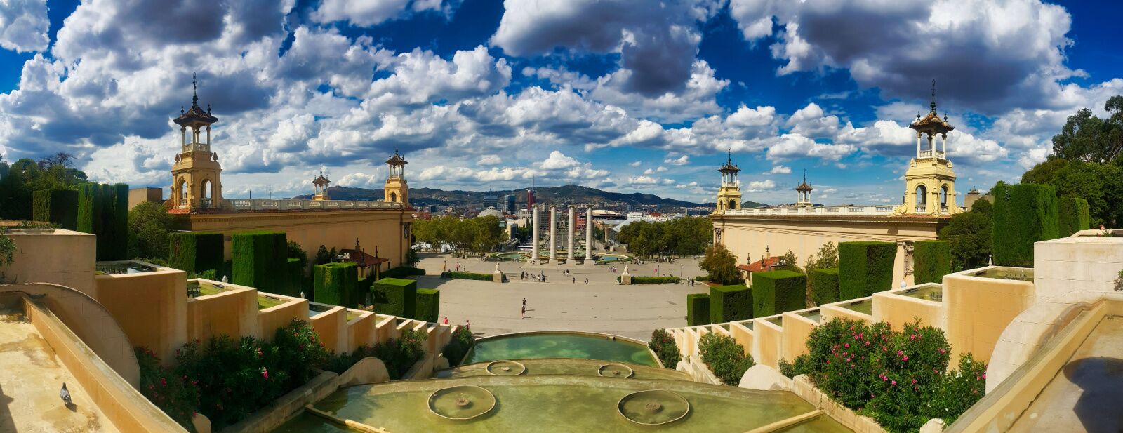 pano view of one of the biggest parks in barcelona with a castle and big botanical garden
