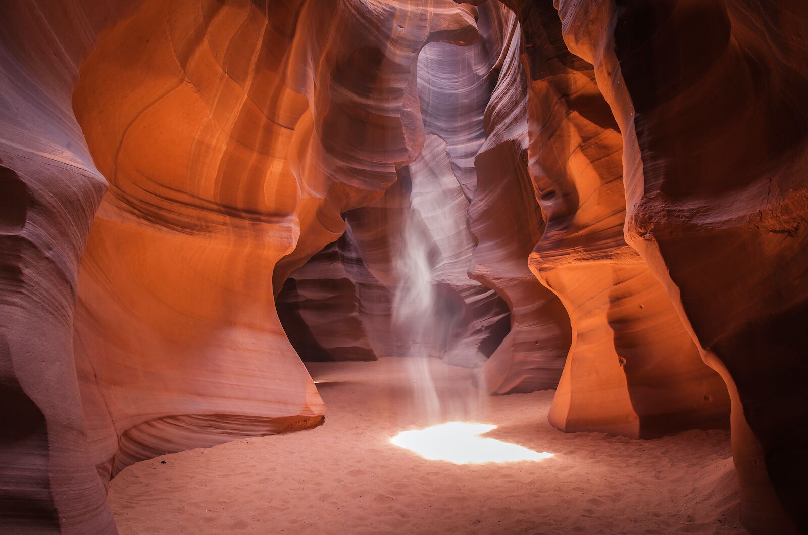 a shaft of light cuts through Antelope Canyon in Arizona