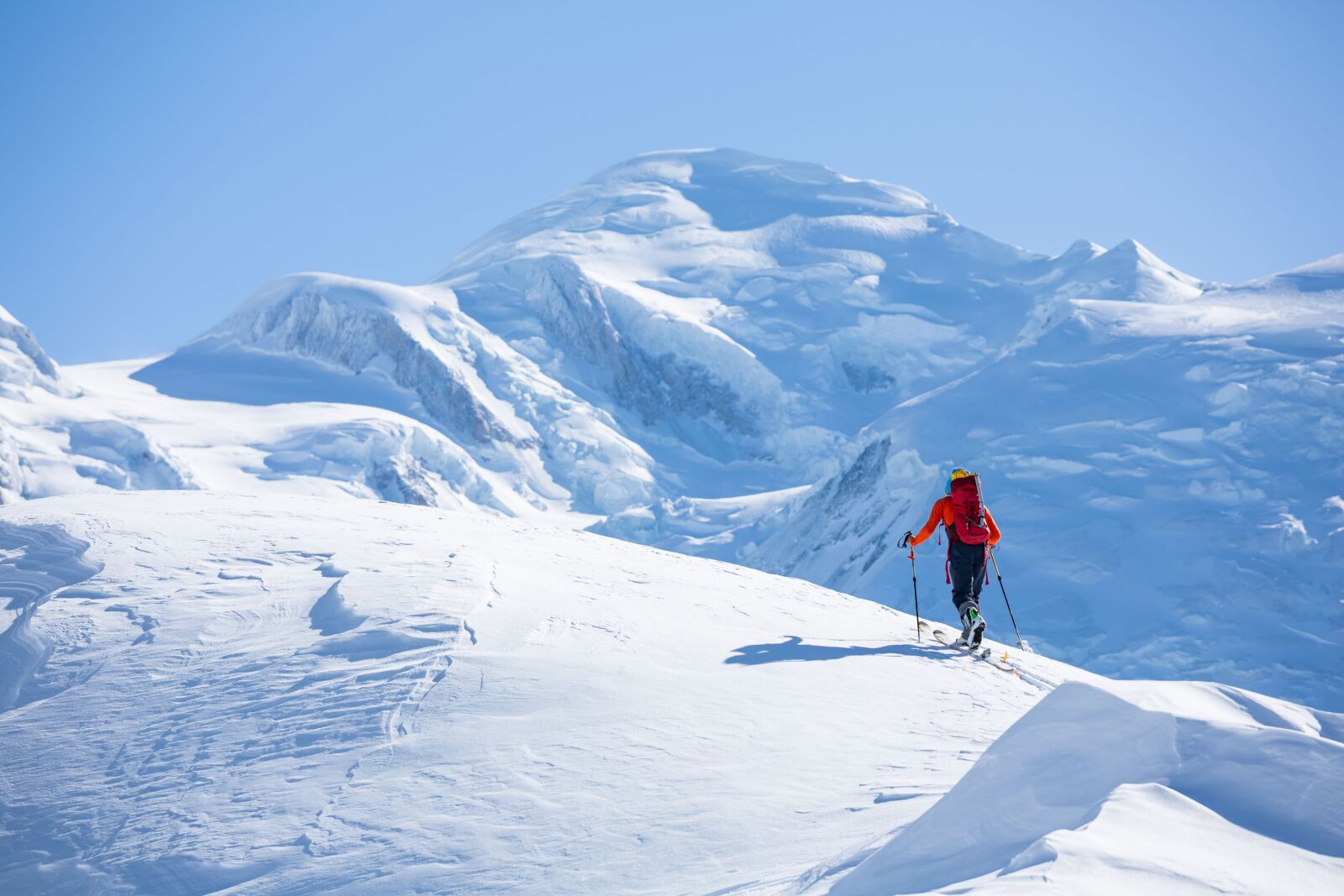 Chamonis is one of the best alps ski resorts for ski touring, as seen here as an advanced skier traverses a ridgeline