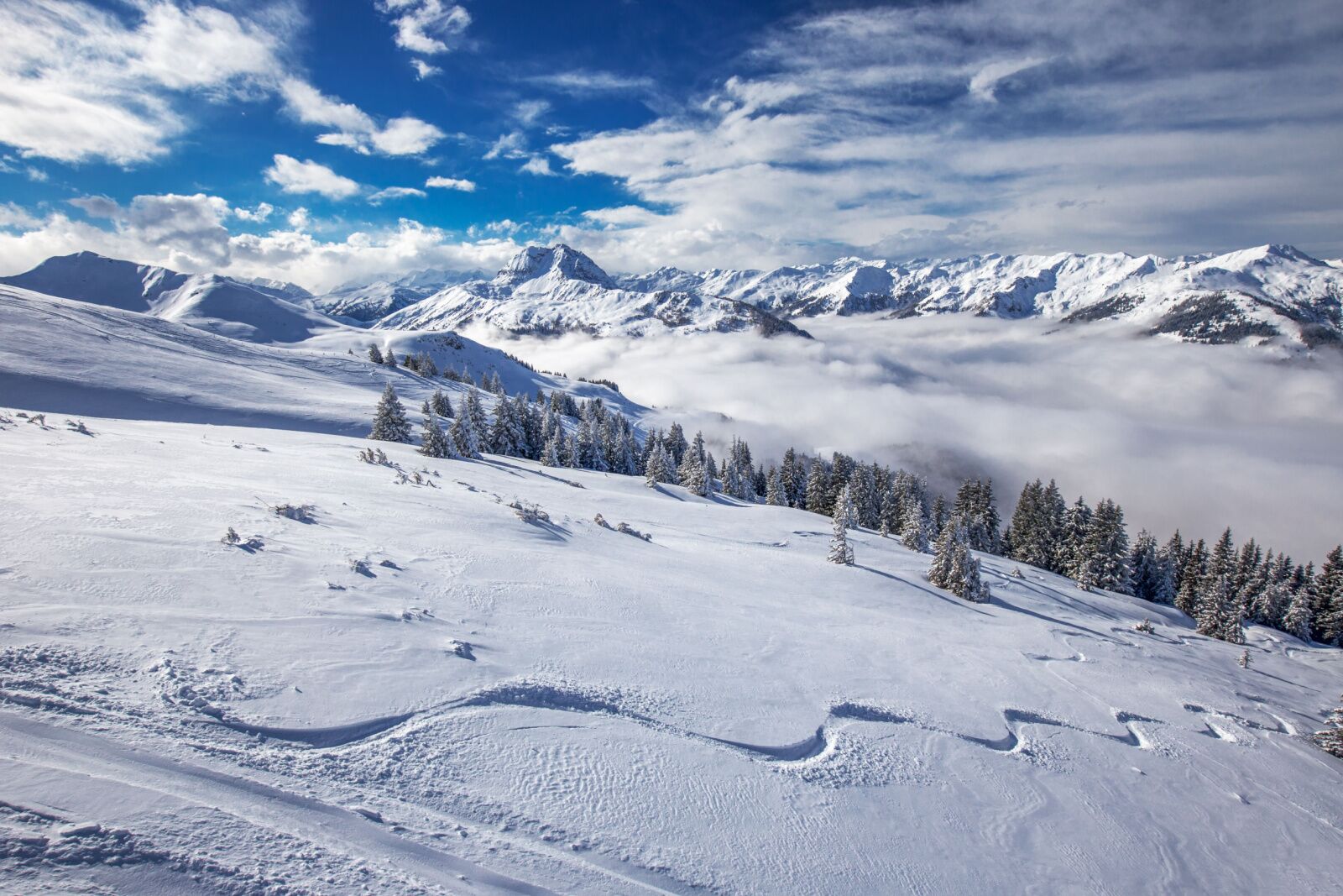 Fresh snow on a slope at Kitzhbuhel, a popular alps ski resort 