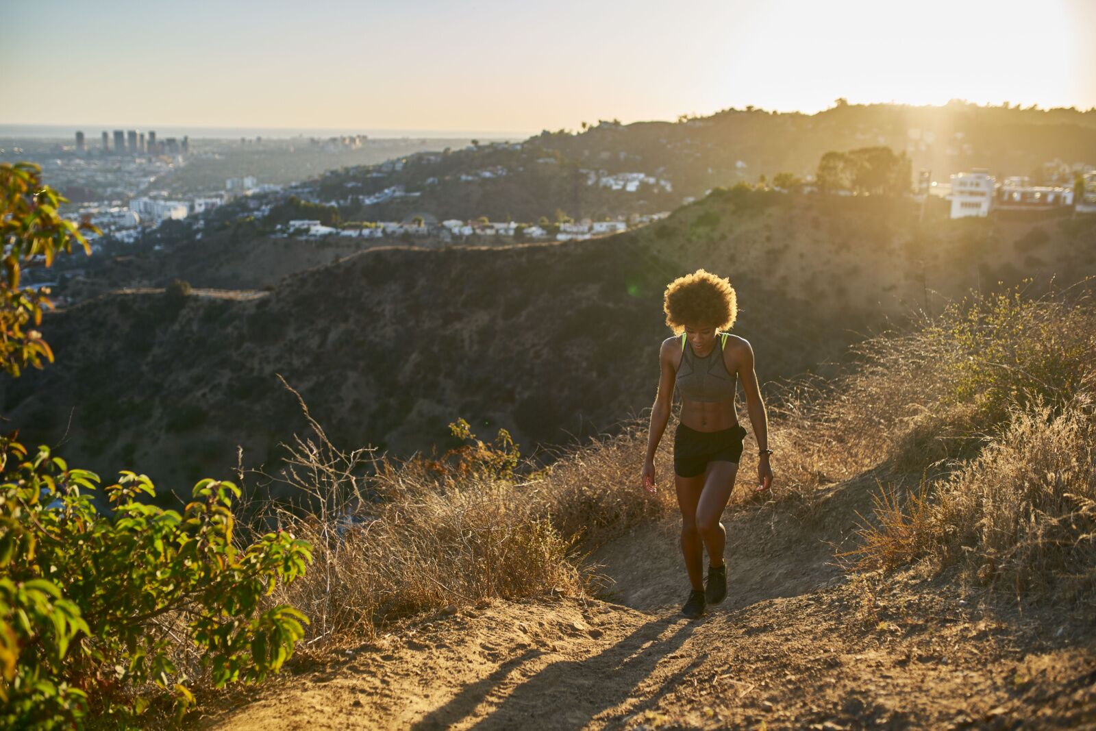 woman in runyon canyon, one of the best hiking parks in los angeles, CA