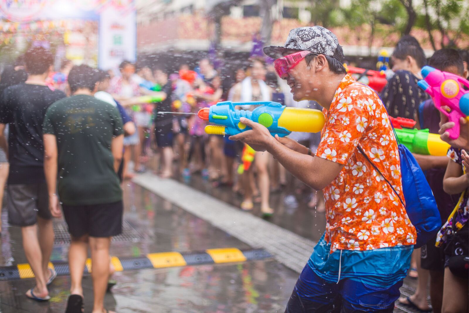 Festivals in thailand - songjkran festival in bangkok, man with squirt gun