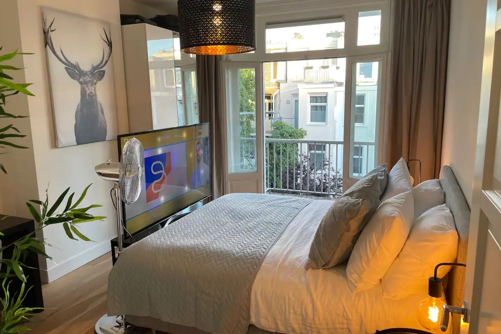 Bedroom with tv in one of the best amsterdam airbnbs for a bachelor party