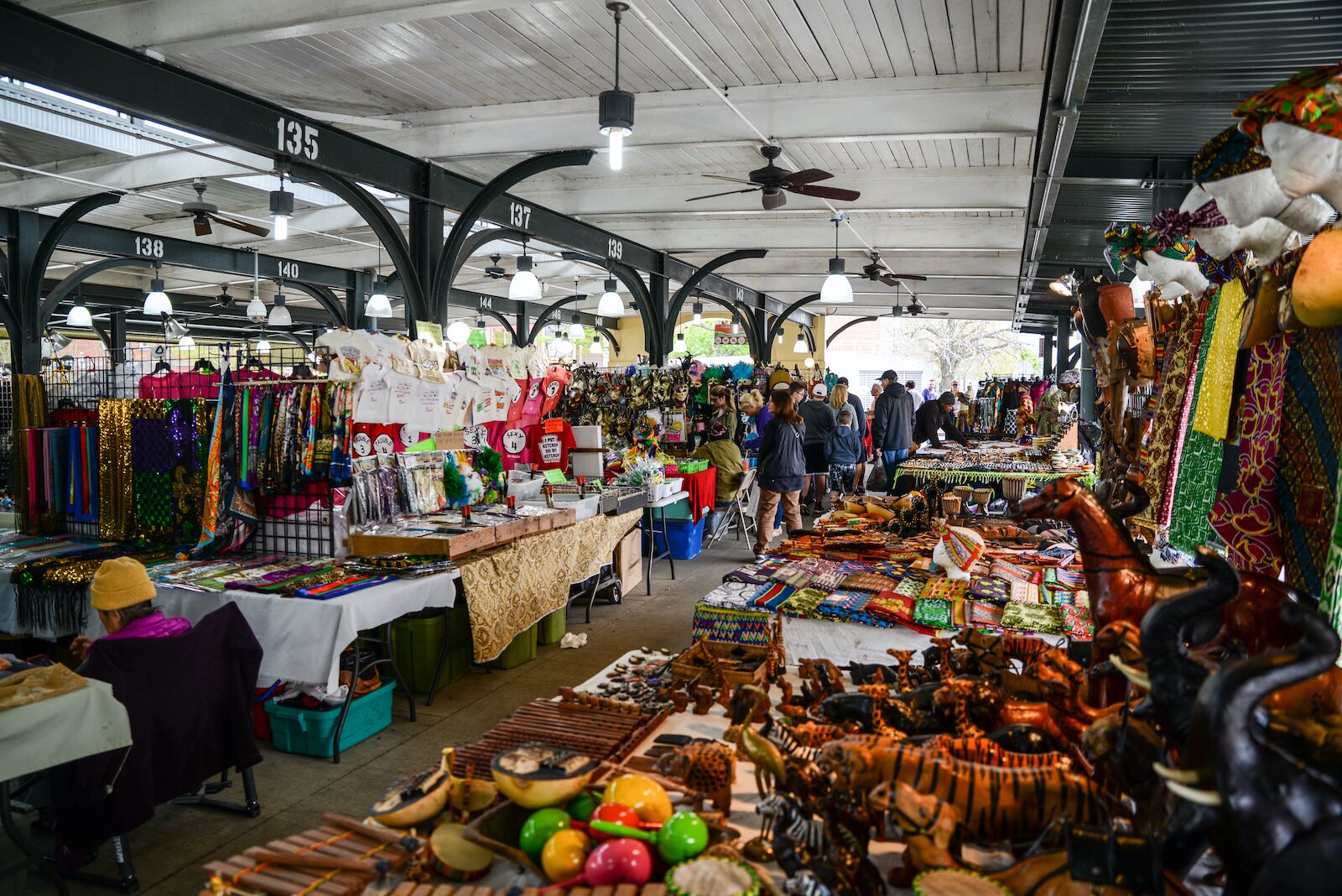 Open air vendors selling clothes and other home goods at French Market New Orleans