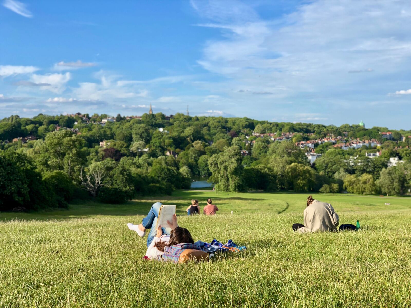 parks in london - people on grass at hamsptead heath