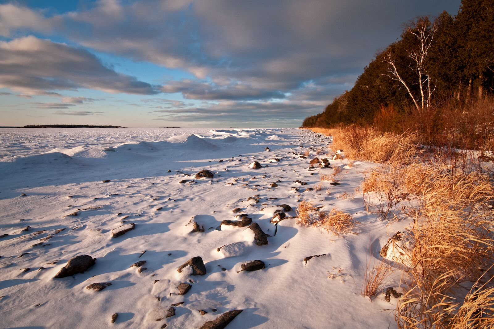 Sunset light on the winter shoreline of Peninsula State Park in Door County, Wisconsin.