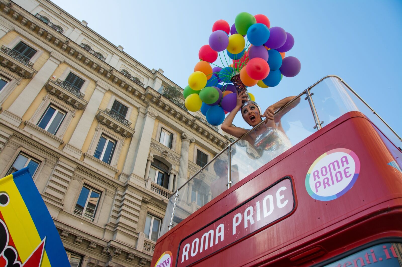 Person in bus at Pride in gay Rome
