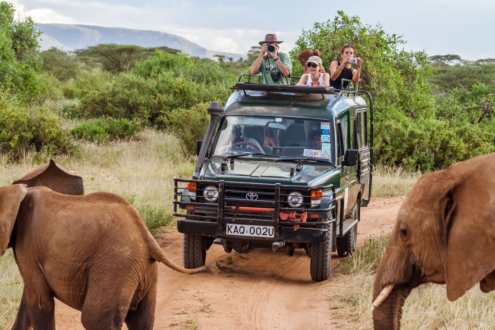 safari car with tourists in kenya