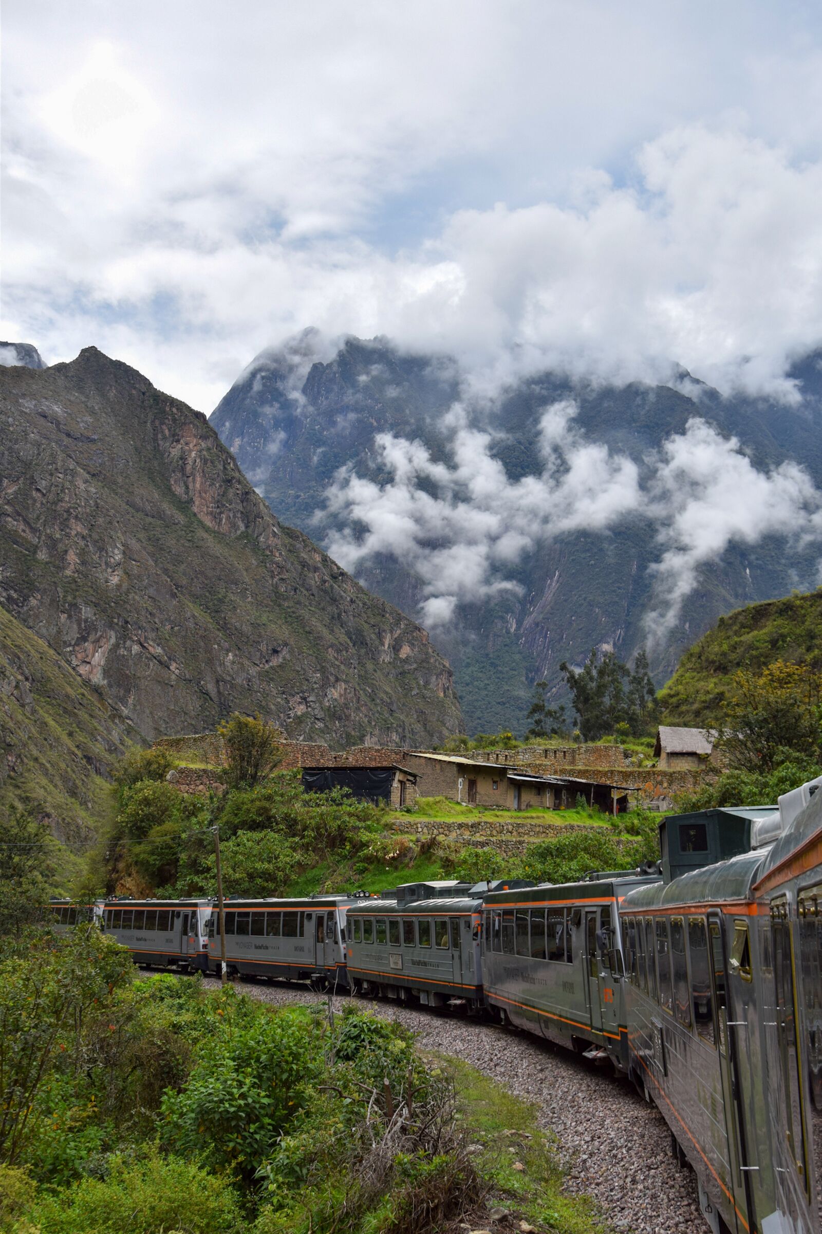 Inca Rail, Peru - valley view with clouds nearing machu picchu