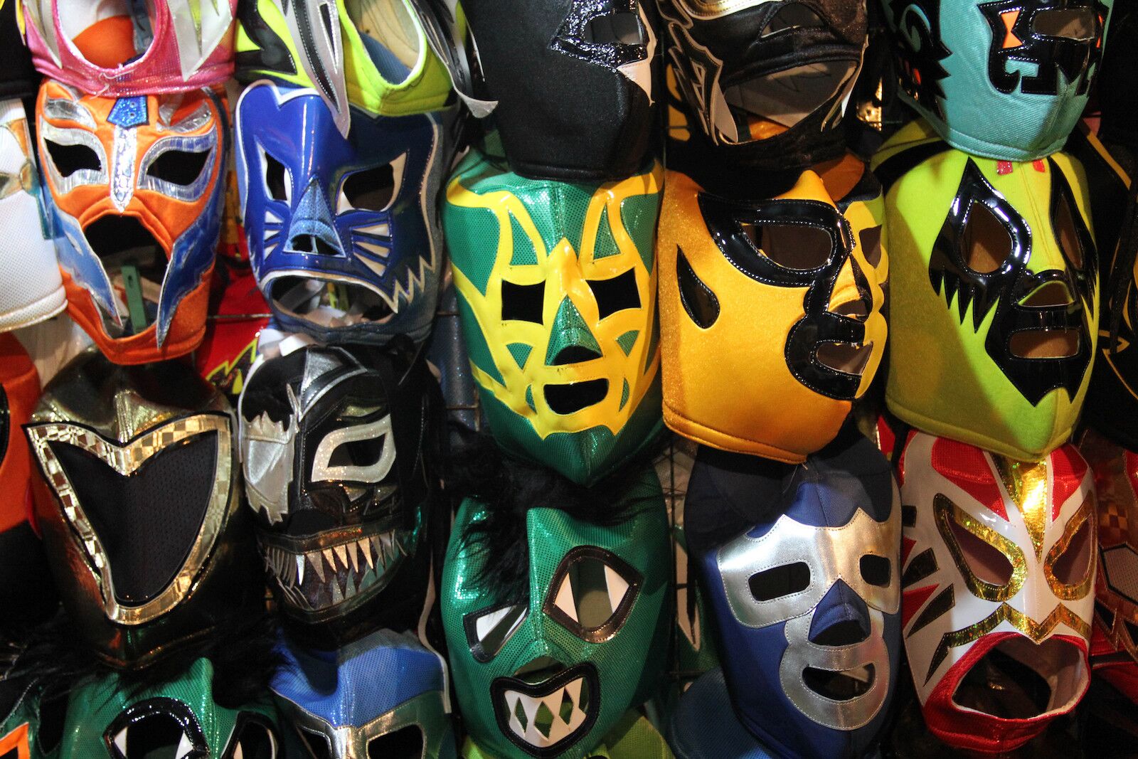 A display of colorful lucha libre masks