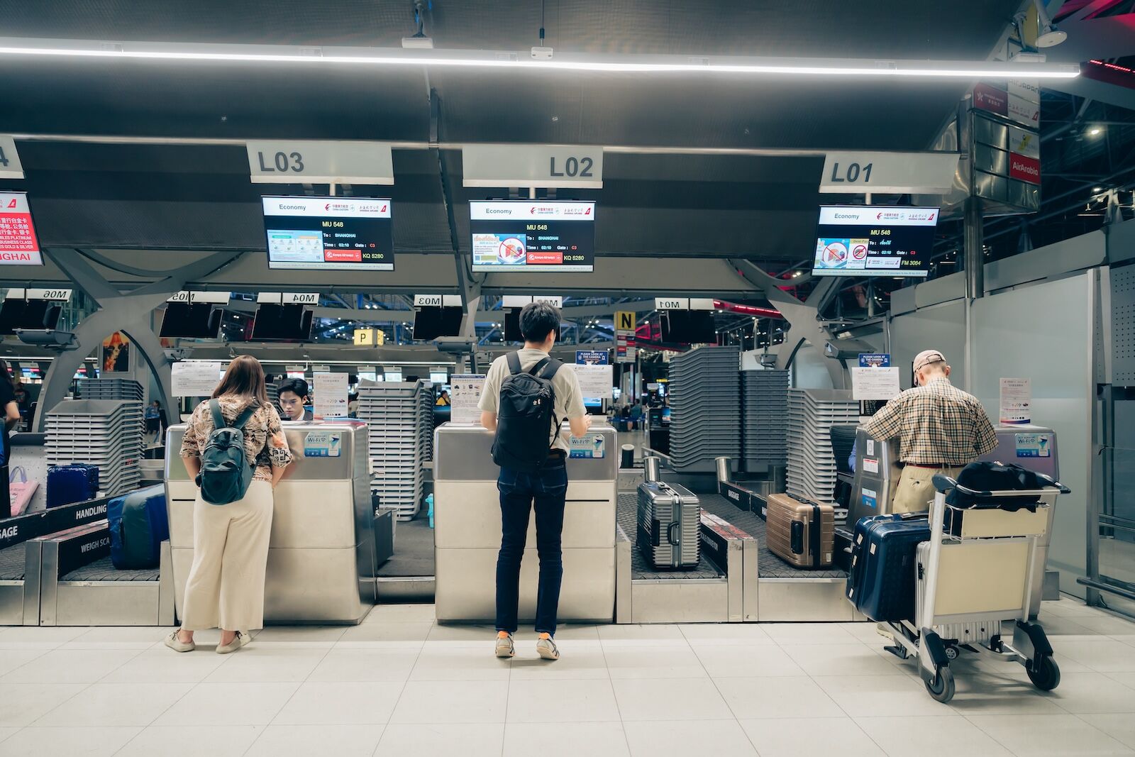man at airport counter
