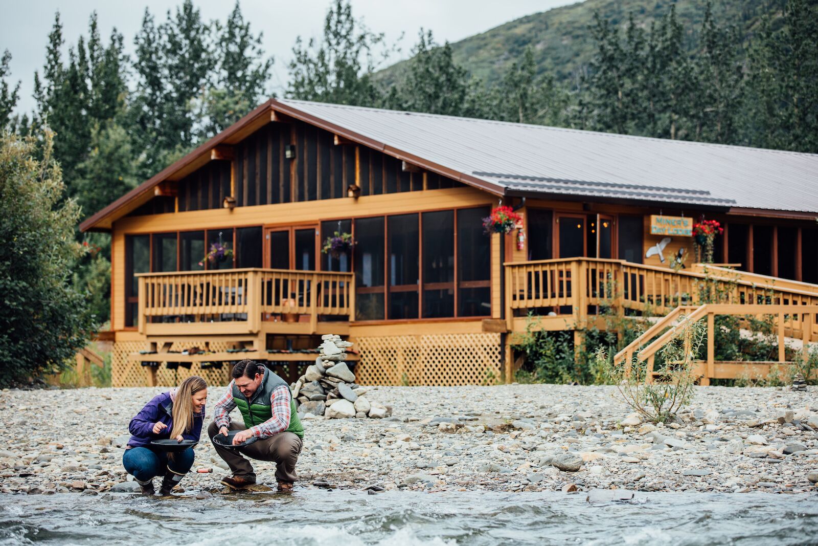 sitting by the river at denali backcountry lodge