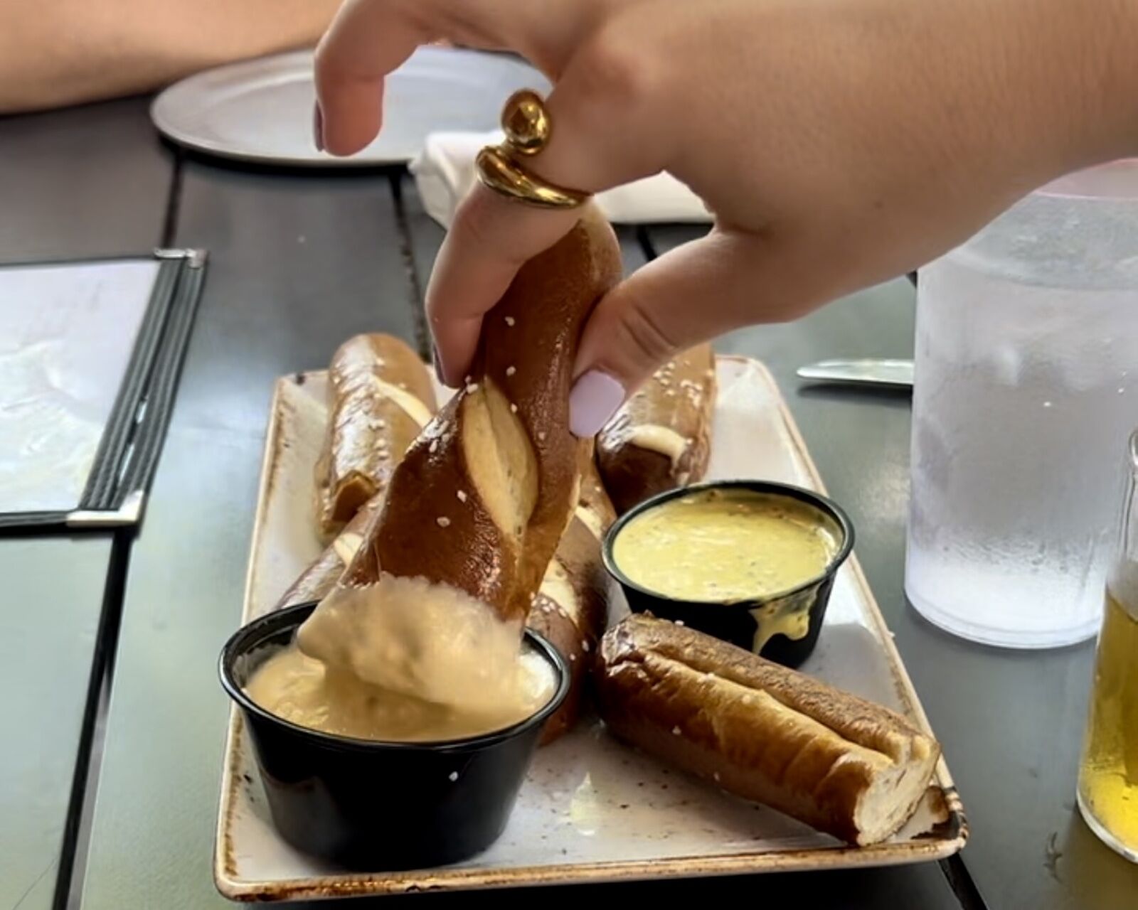 pretzel dipped in cheese