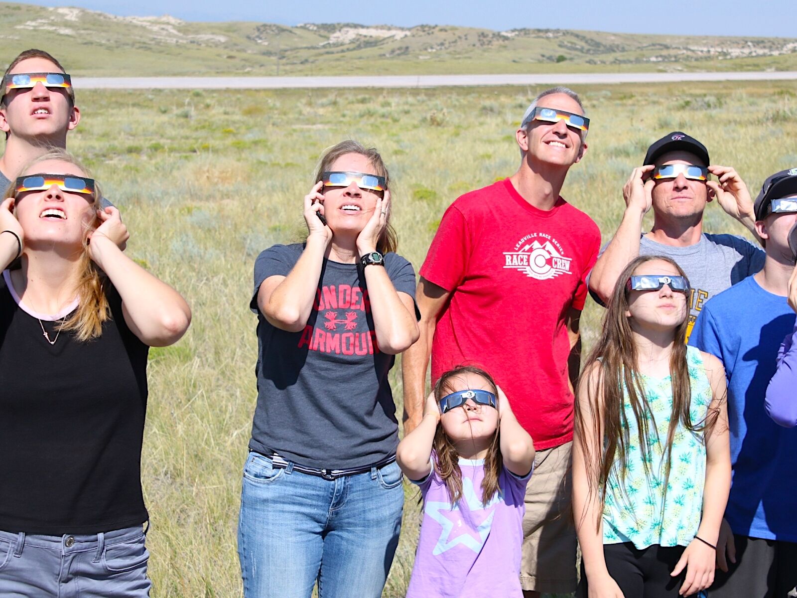 Family watching total solar eclipse