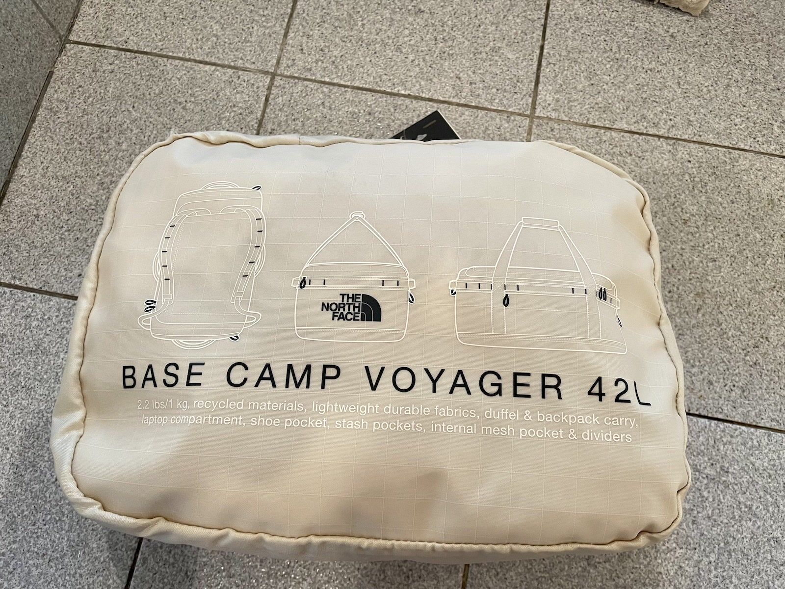 The Base Camp Voyager Duffel from The North Face, packed into the storage pocket.