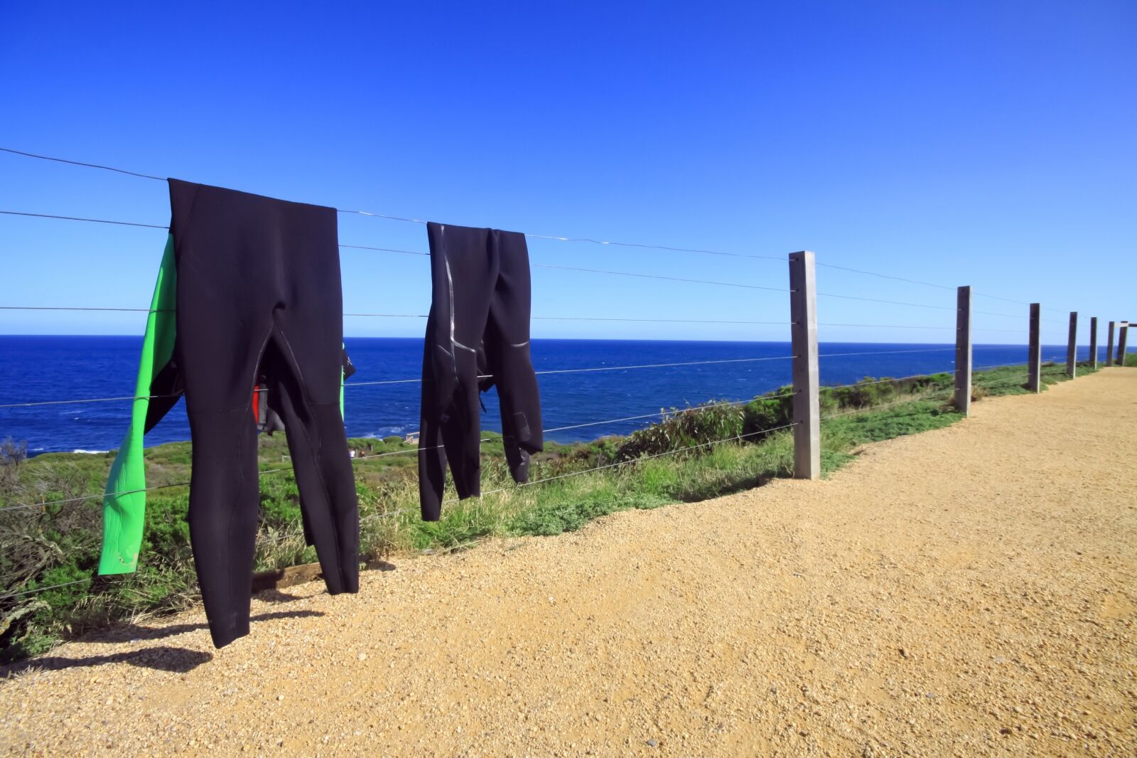 Wet Suits Drying Out in the Sun