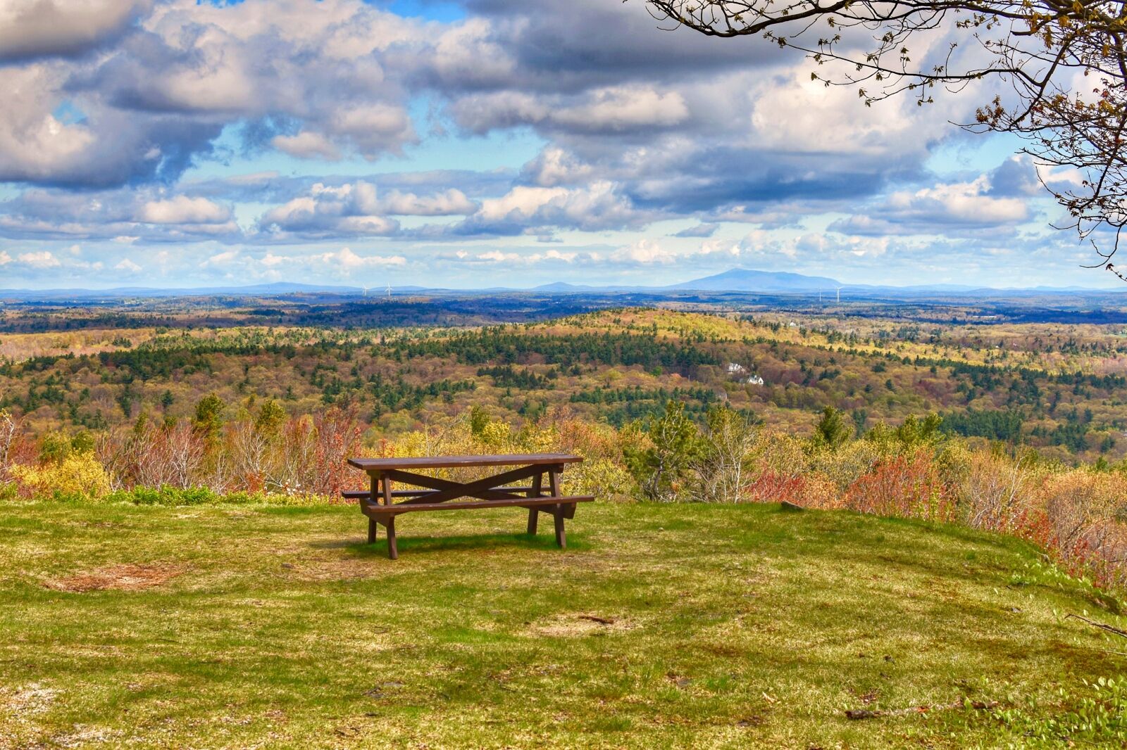 Picnic table with a scenic view of Monadnock Mountain in Wachusett Mountain State Reservation a stop on a Massachusetts Road Trip