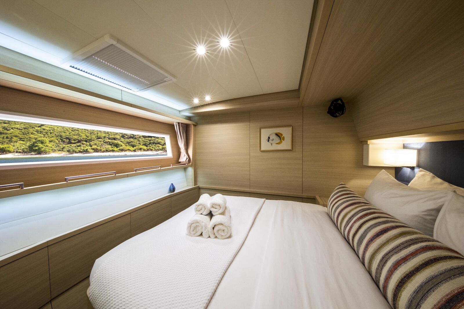 bed on catamaran with nomada at sea