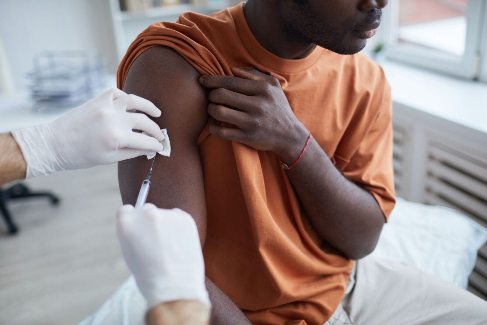 person getting a travel vaccine - health emergency abroad 