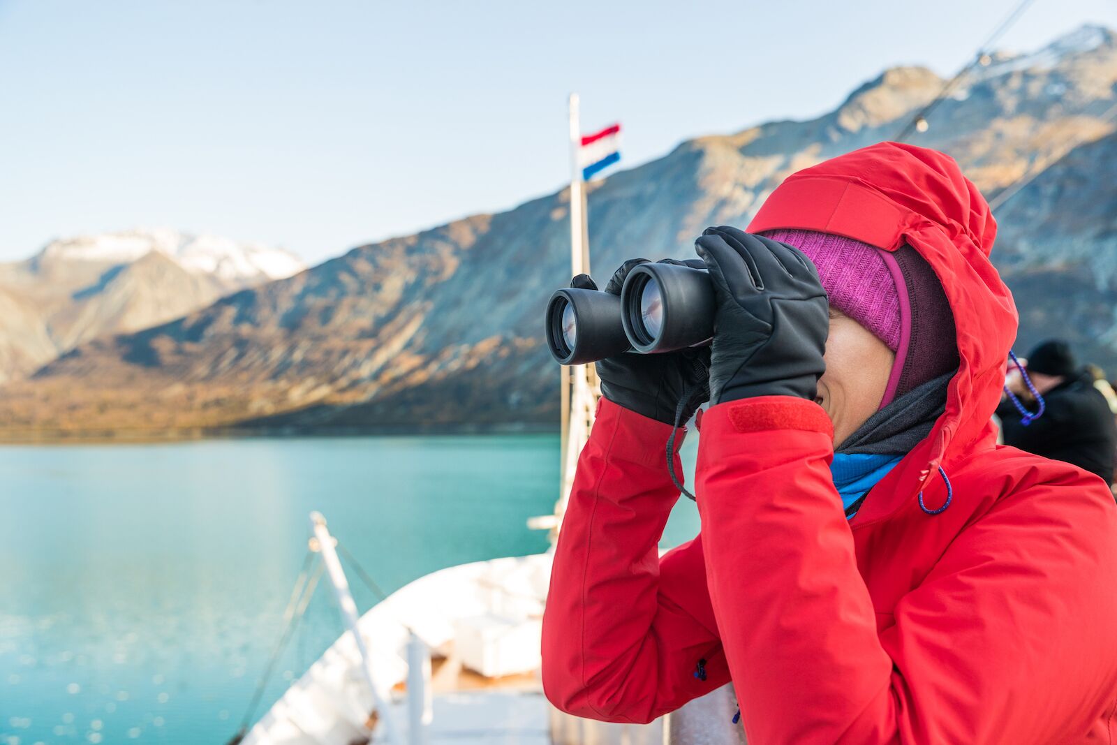 Woman on a cruise ship with binoculars