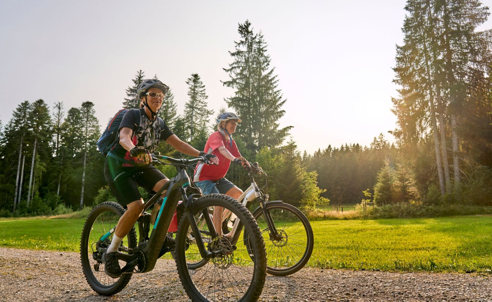 two women on e-bikes on trails 