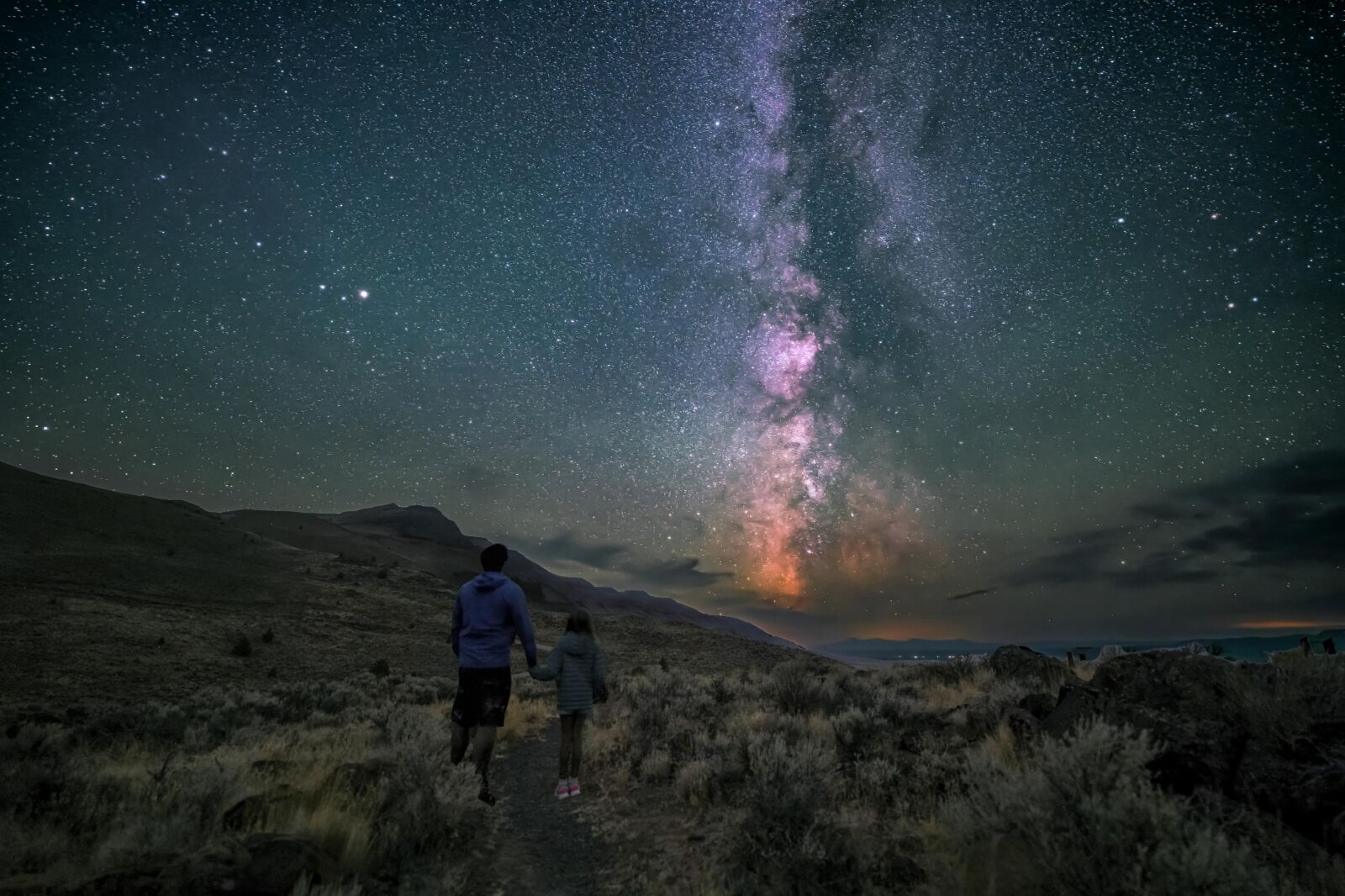 Person and child with star studded night in Oregon Outback
