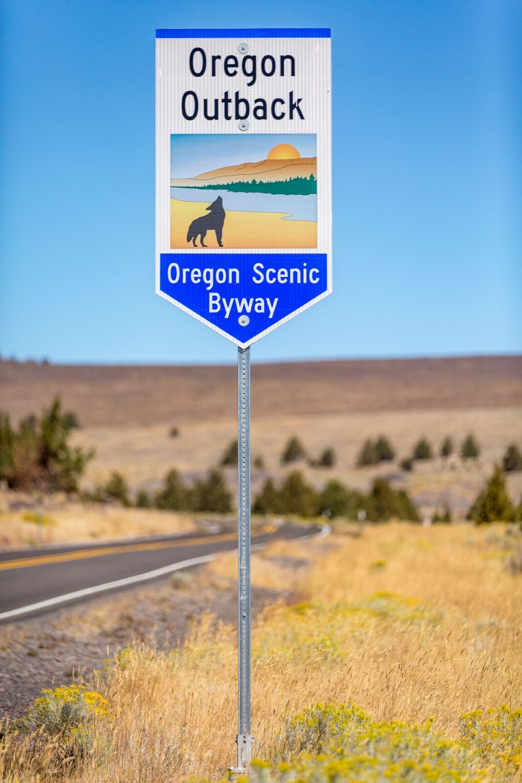 Oregon Scenic Byway sign by road in Oregon Outback
