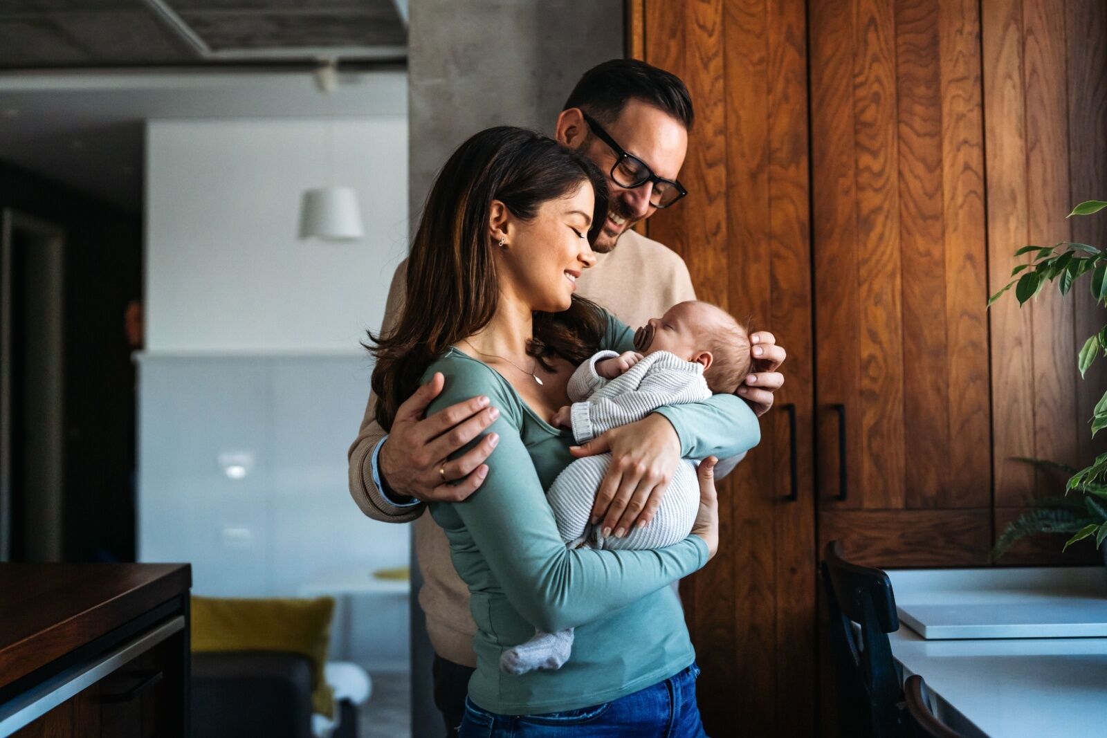 postnatal retreats - family holding baby 