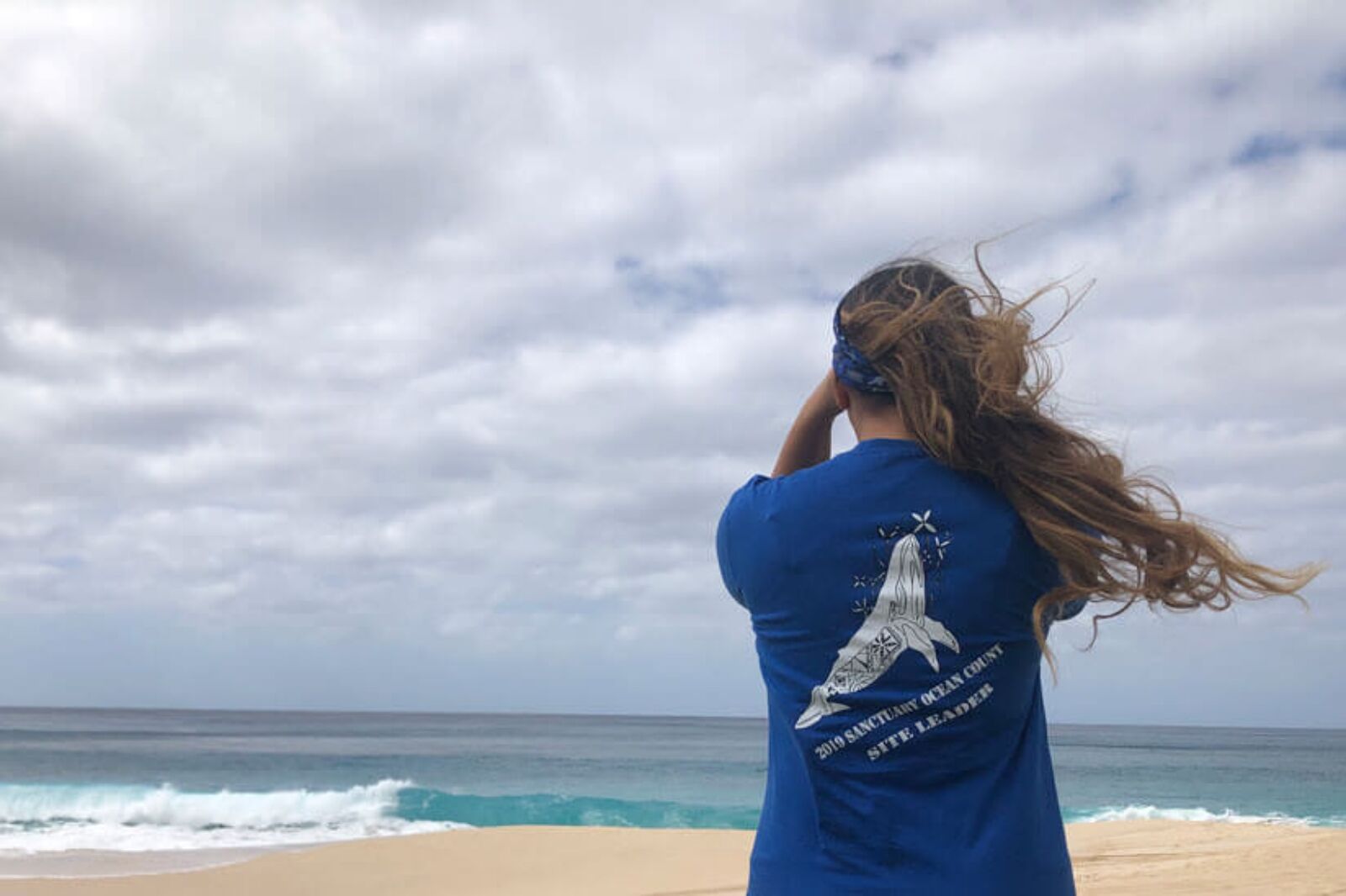 Citizen volunteer with Hawaiian Islands Humpback Whale National Marine Sanctuary counting whales in Hawaii 
