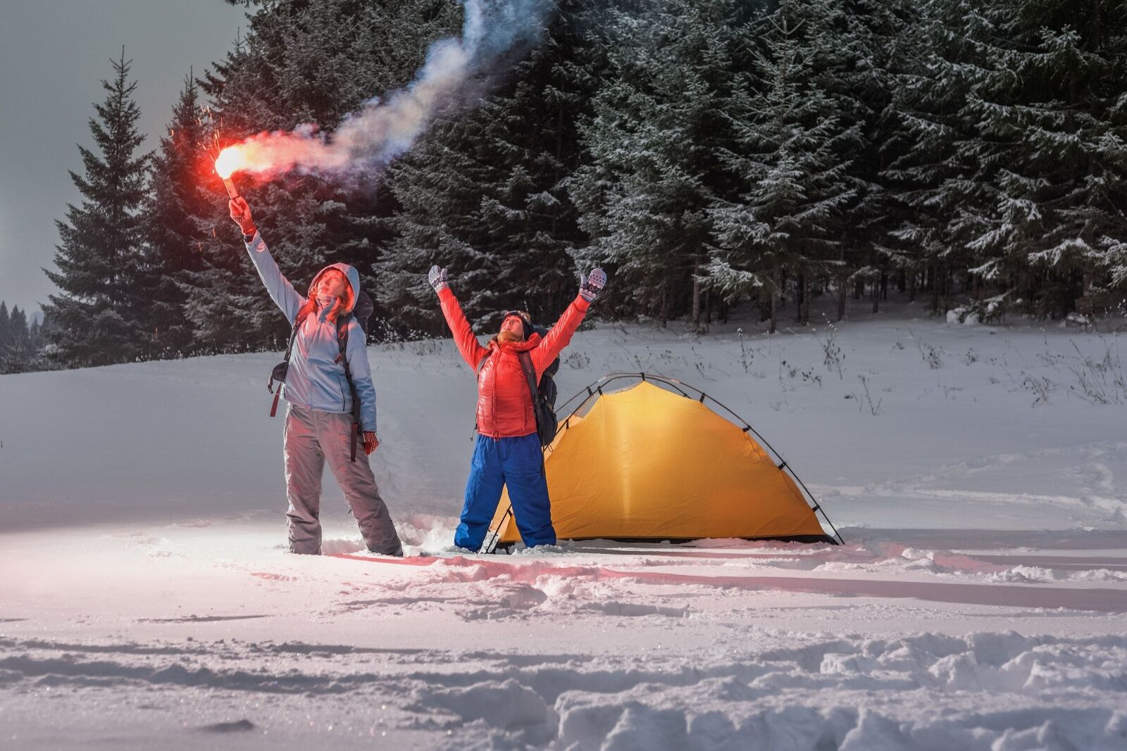 rescued people in snow with flare