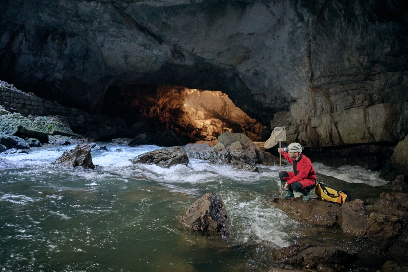 Person by pool in Postojna Cave