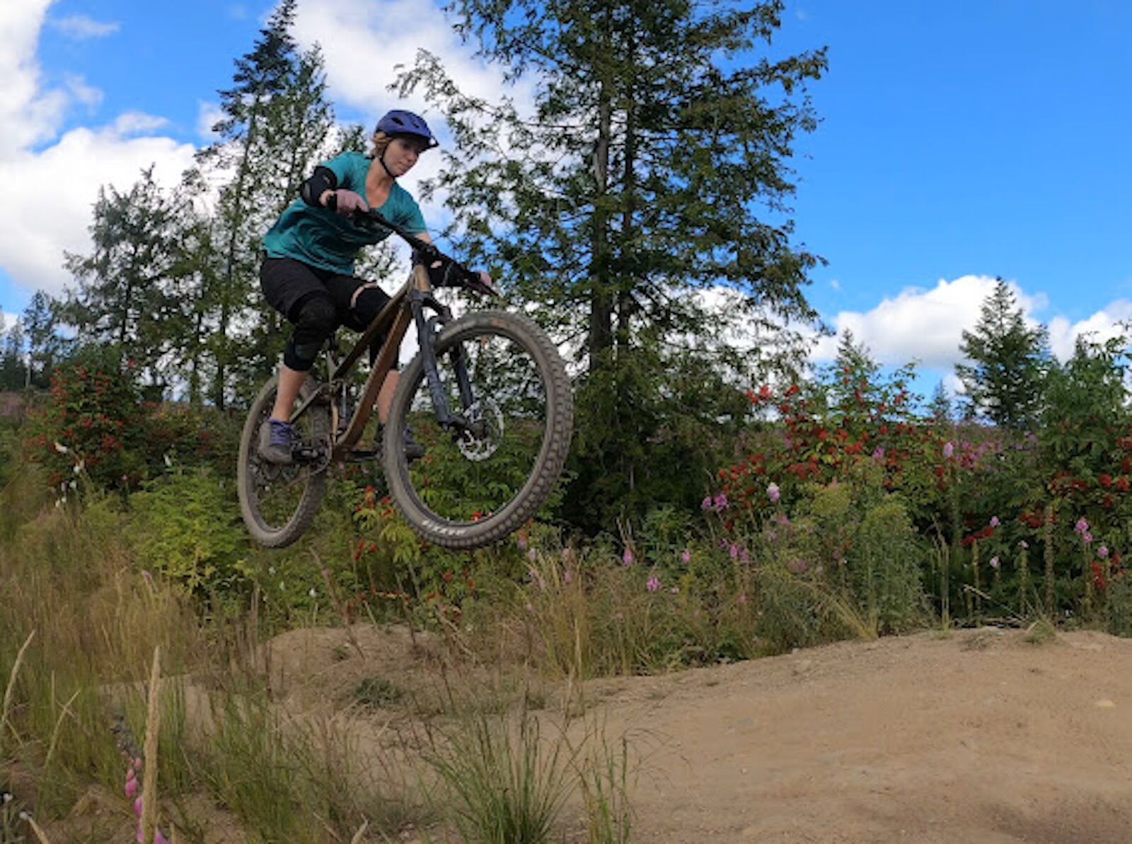 mountain bike parks - woman jumping