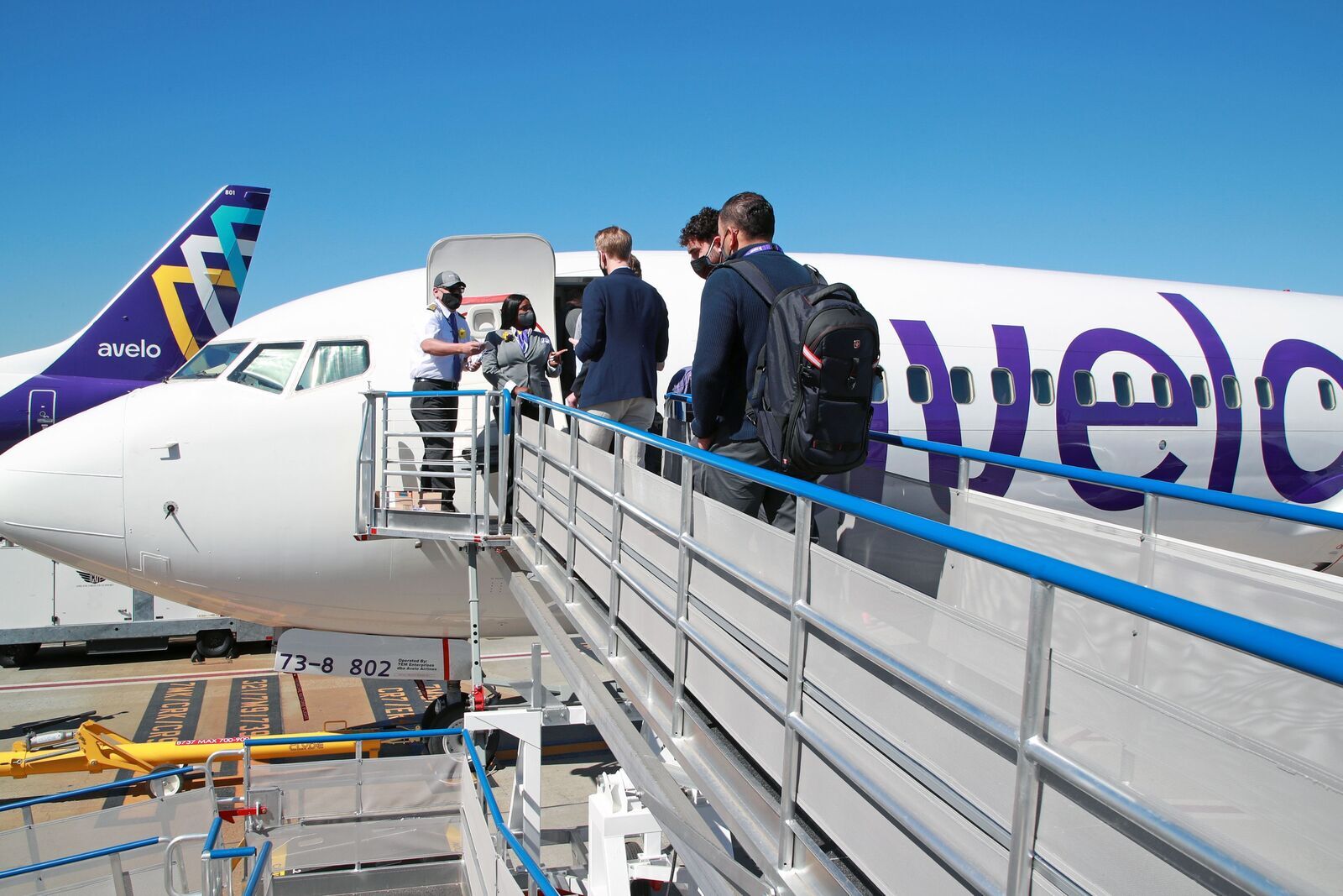 people boarding plane 