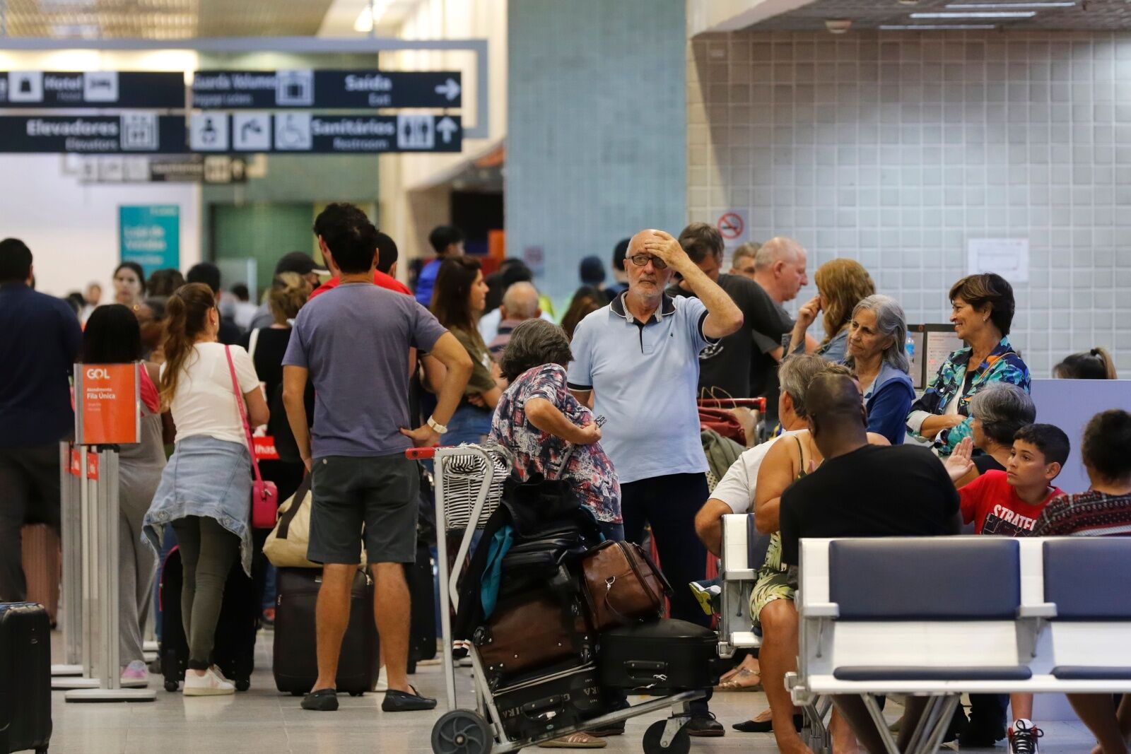 summer flight delays - people at airport