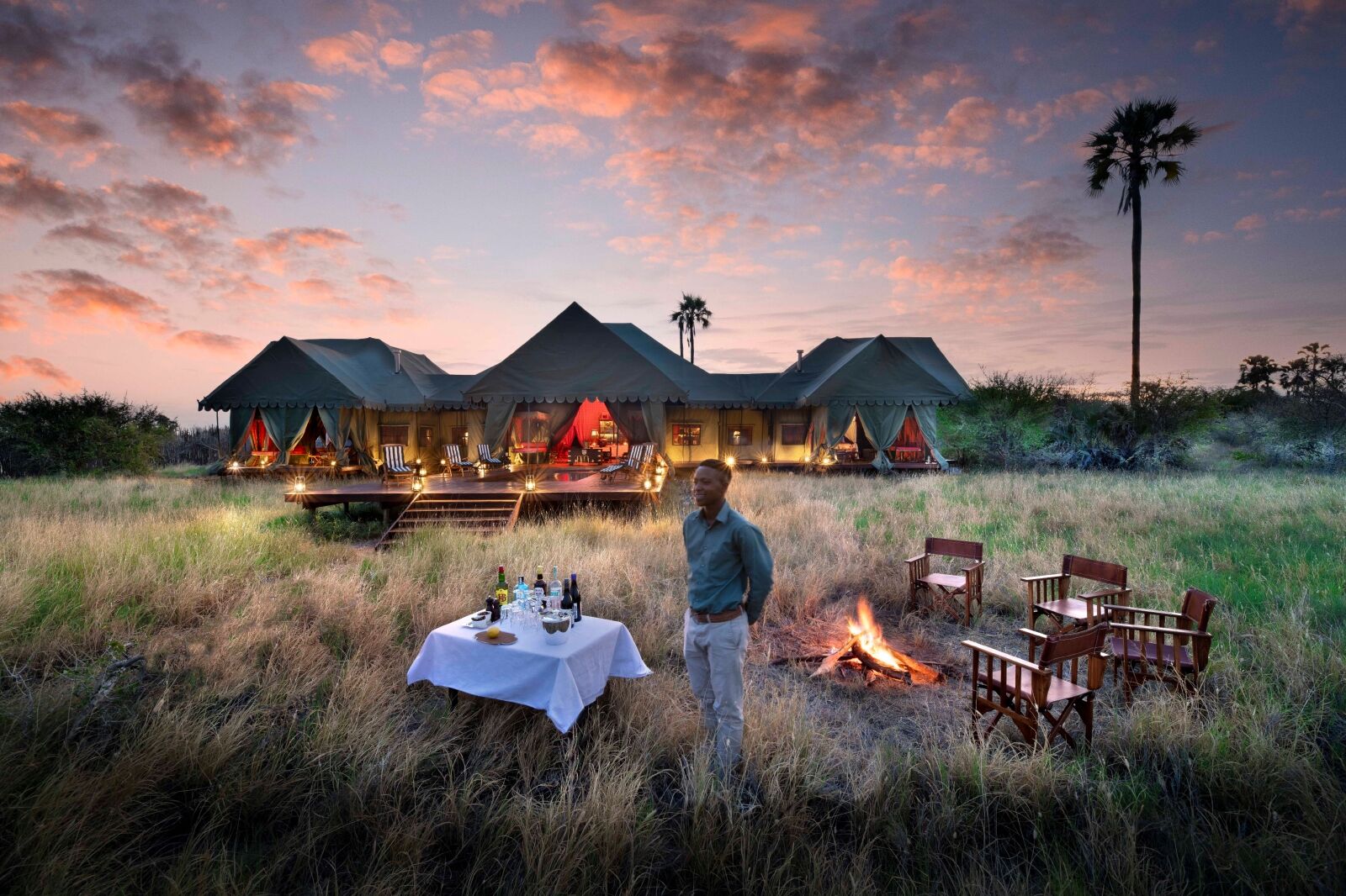 Man standing in front of Jacks Private Camp in Botswana one of the best new hotels for 2024