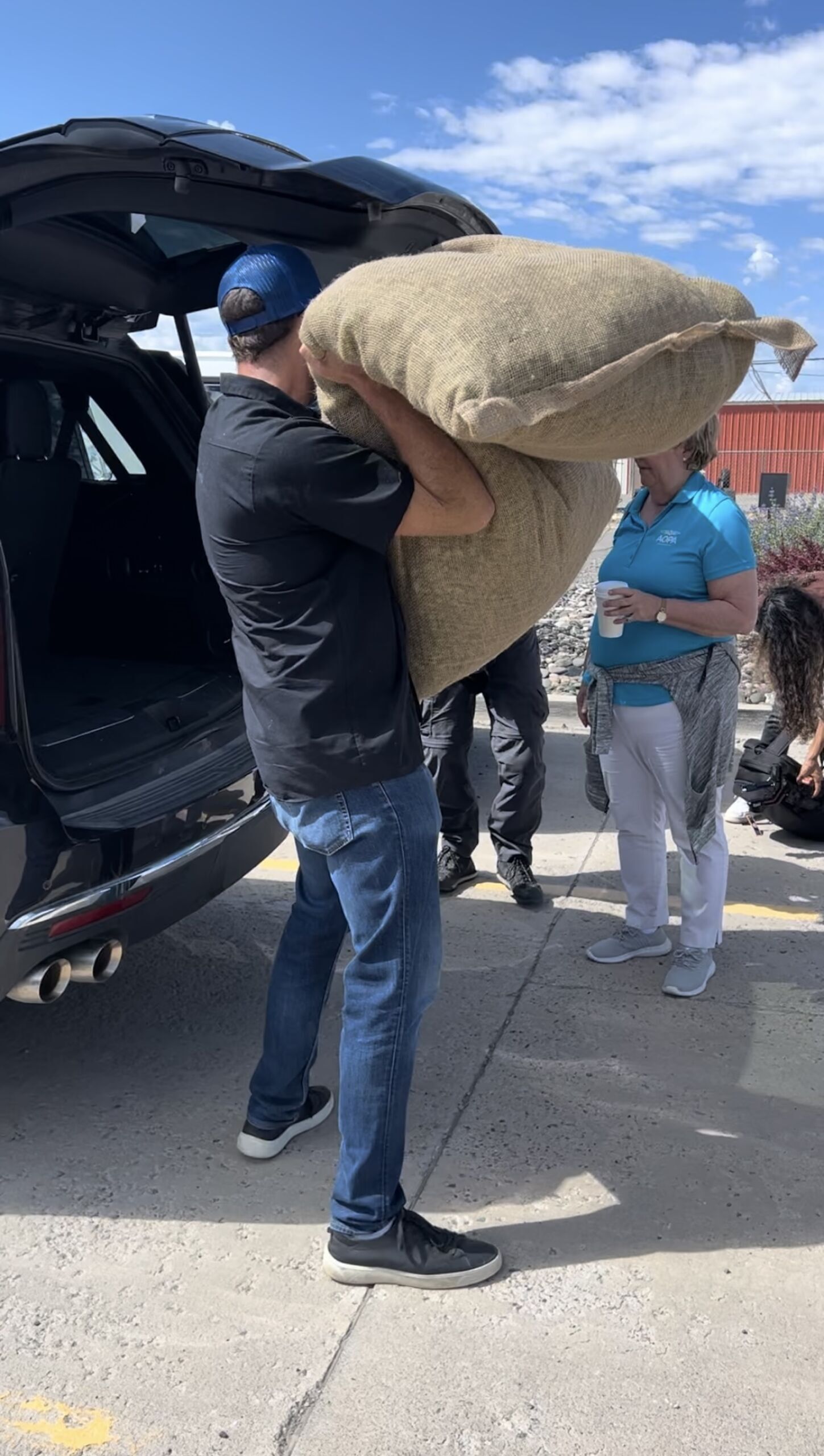 man loading hops into plane