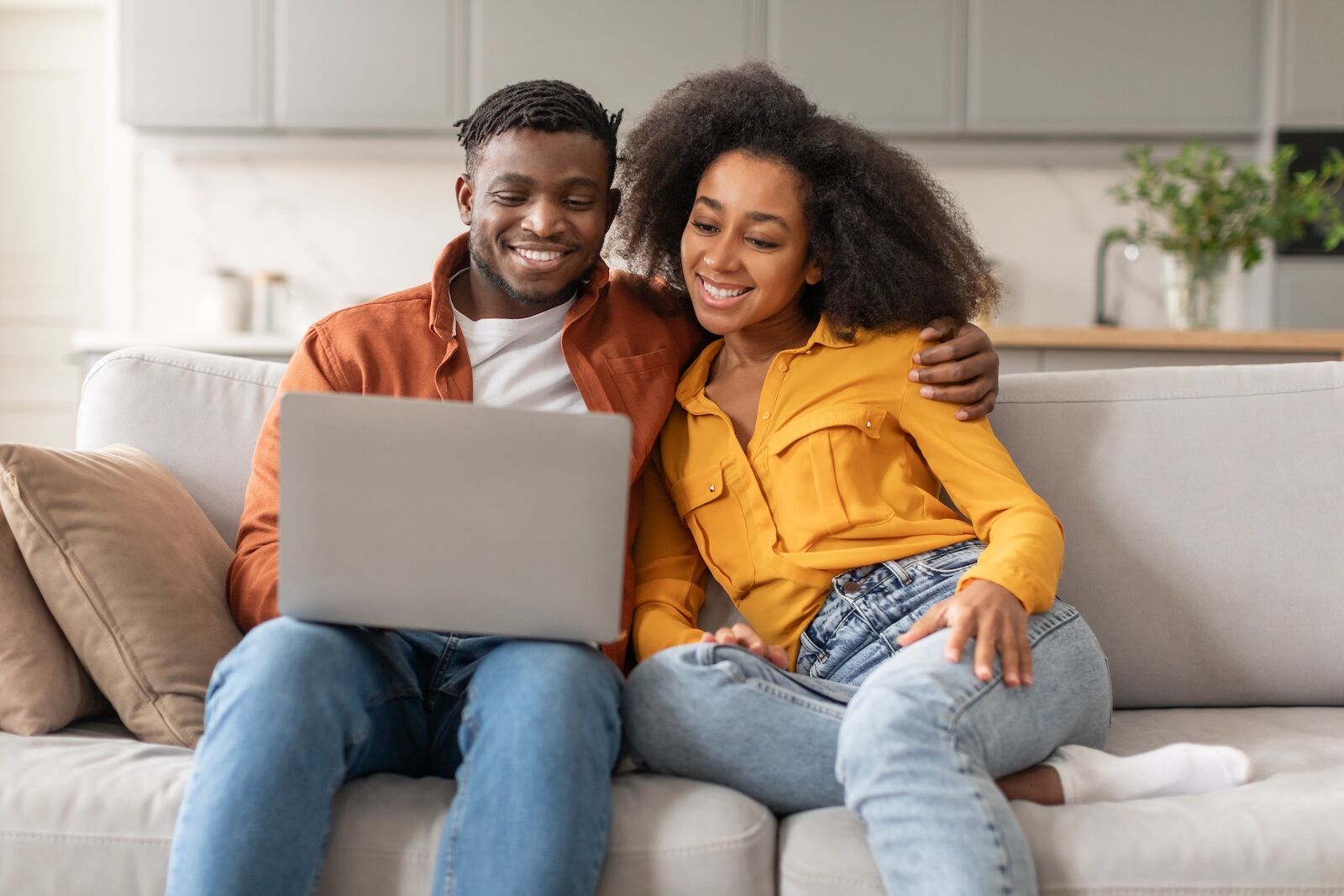 national cheap flight day - couple looking at costs