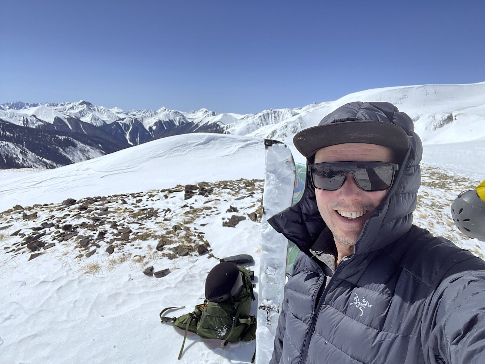 man with splitboard gear in mountains