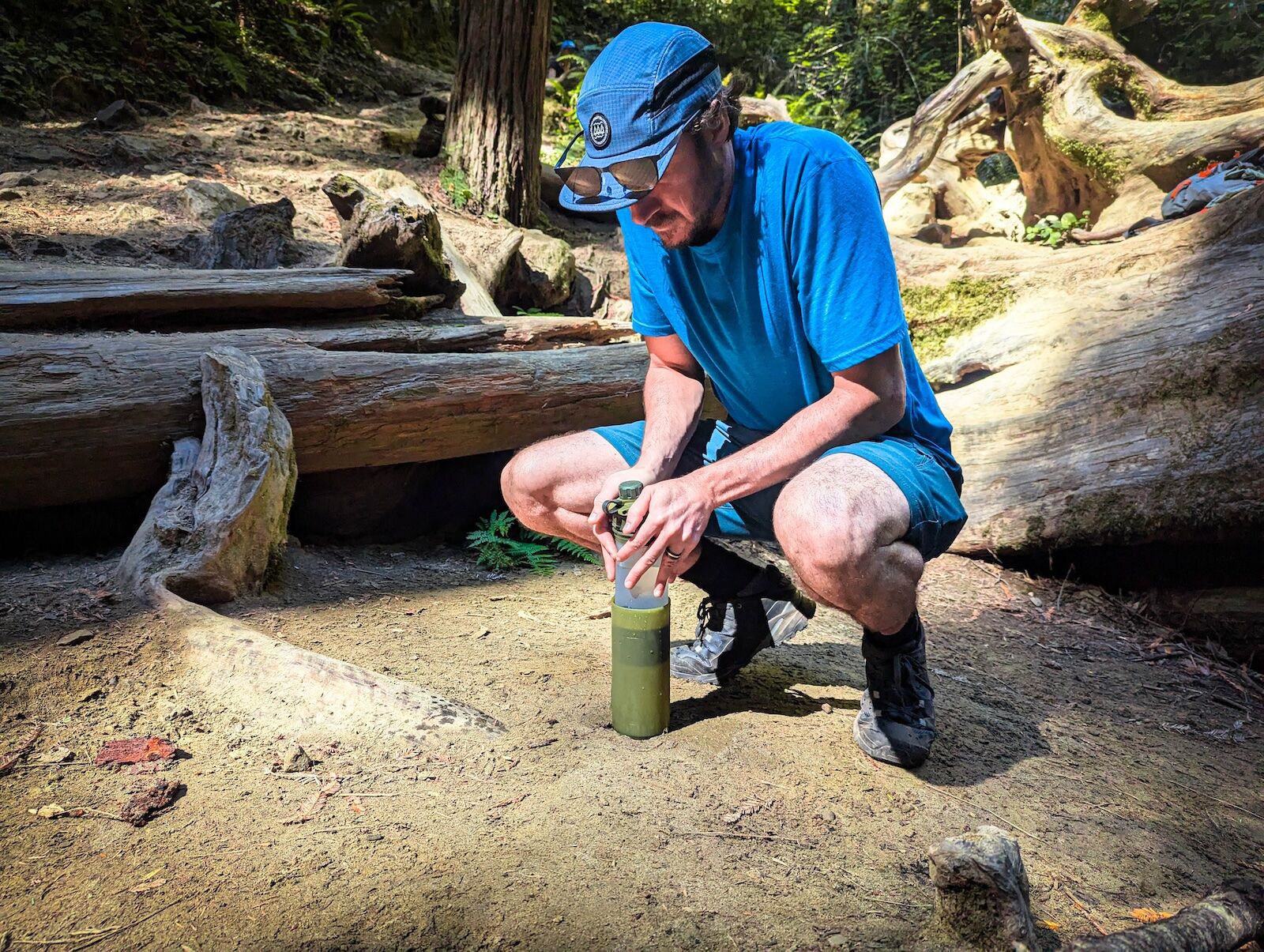 grayl water bottle in use - filter water bottle