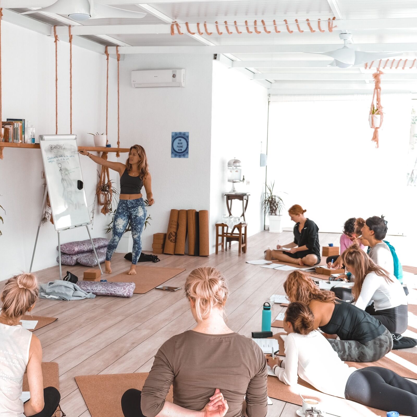 woman leading yoga teacher training