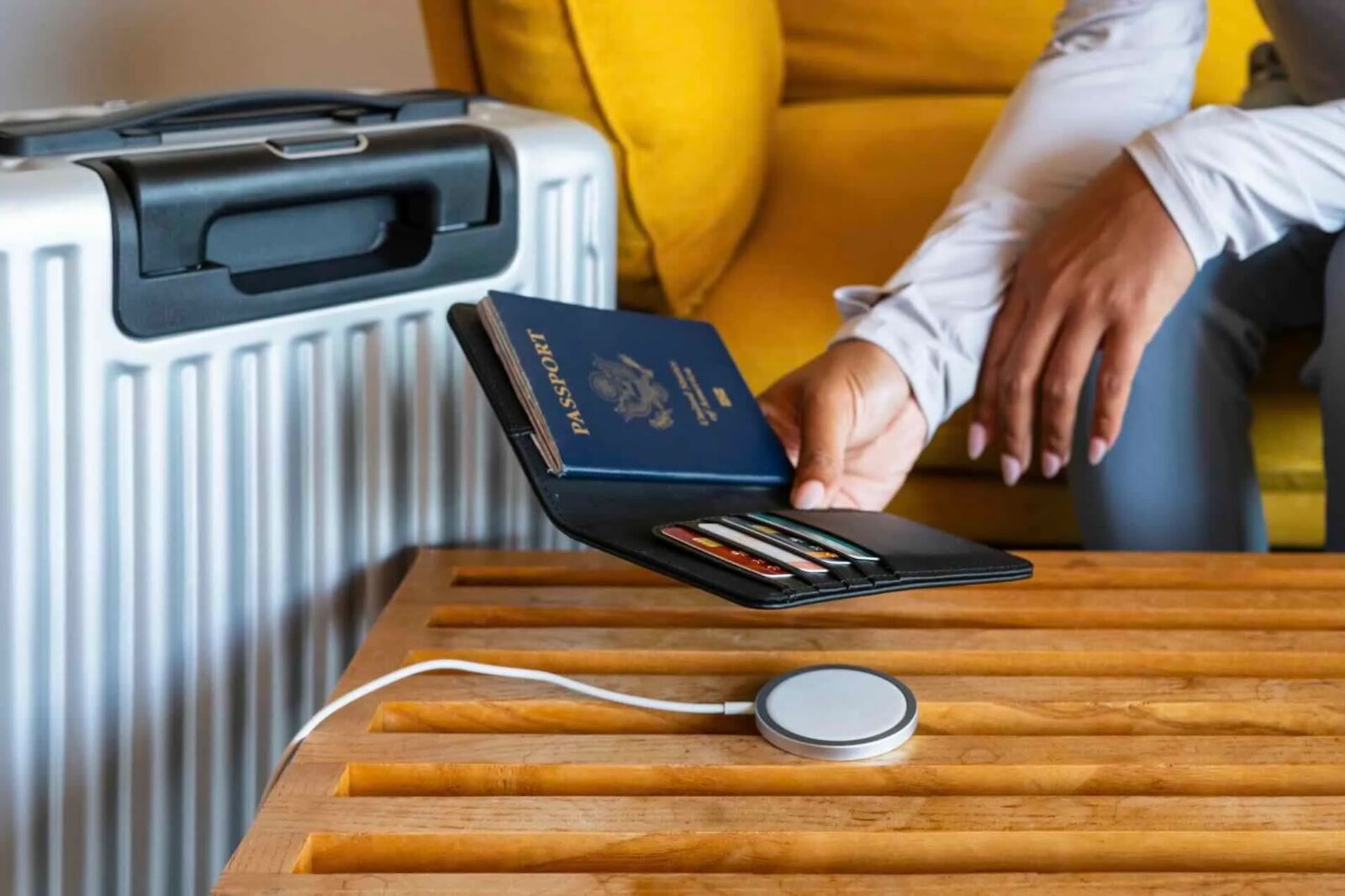 Woman charging Satechi passport cover