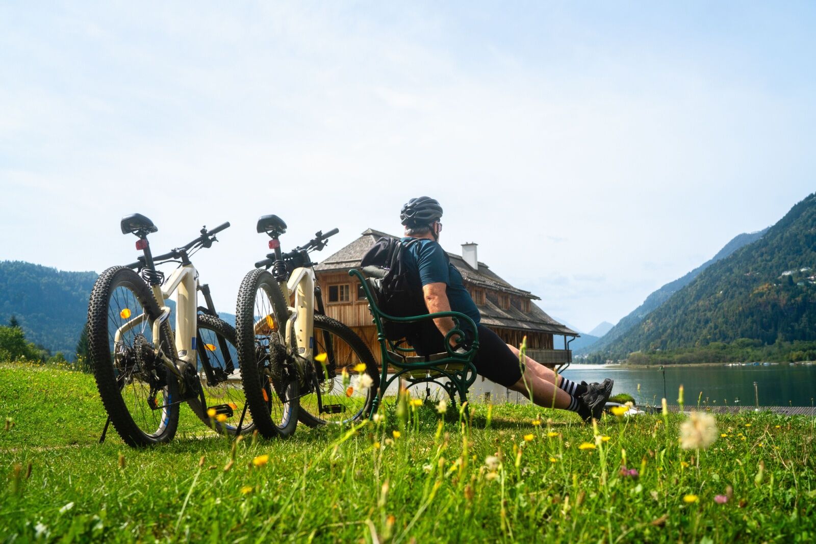 european bike tours - guy on bench at lake