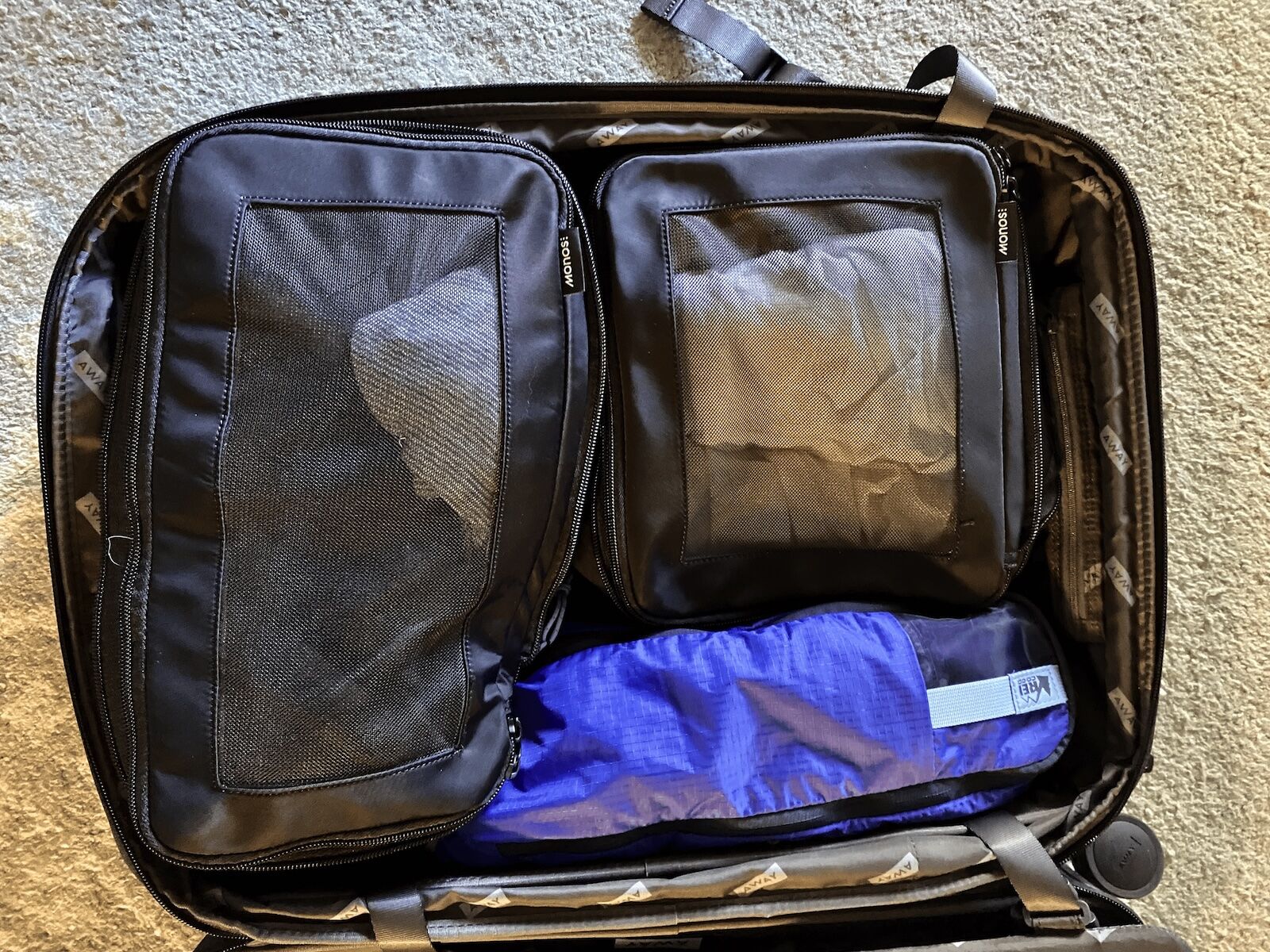 rei packing cubes in suitcase