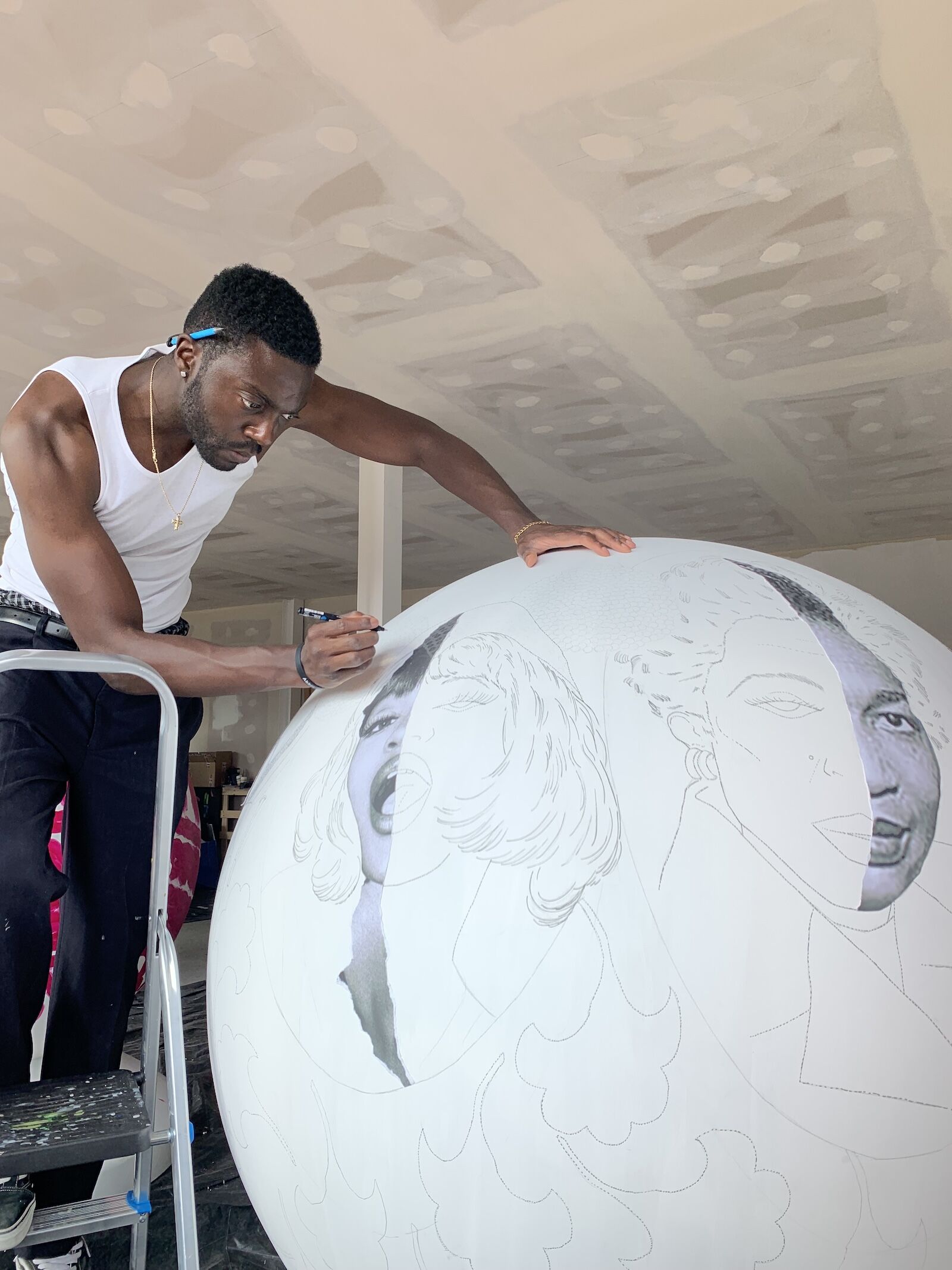 Emmanuel Unaji working on art